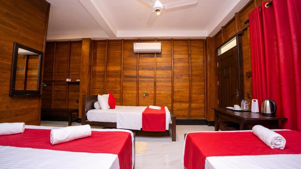 Family Room at Shady Mango Villa β wooden walls with refrigerator and comfortable furnishings