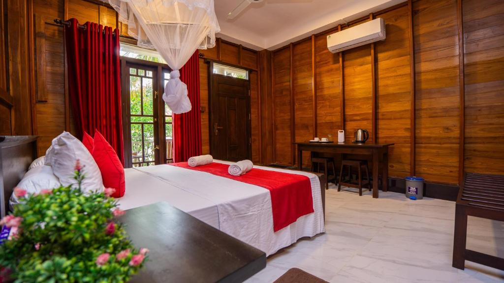 Family Room at Shady Mango Villa β wooden walls with refrigerator and comfortable furnishings